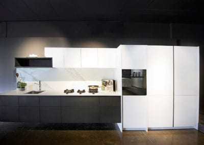 Rempp Rockface and Lacquer floating kitchen with feature open shelving and PITT cooktop